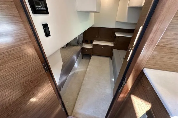  Yacht Photos Pics 2019 Cruisers Yachts 390 Express Coupe interior cabin with modern wood finish.