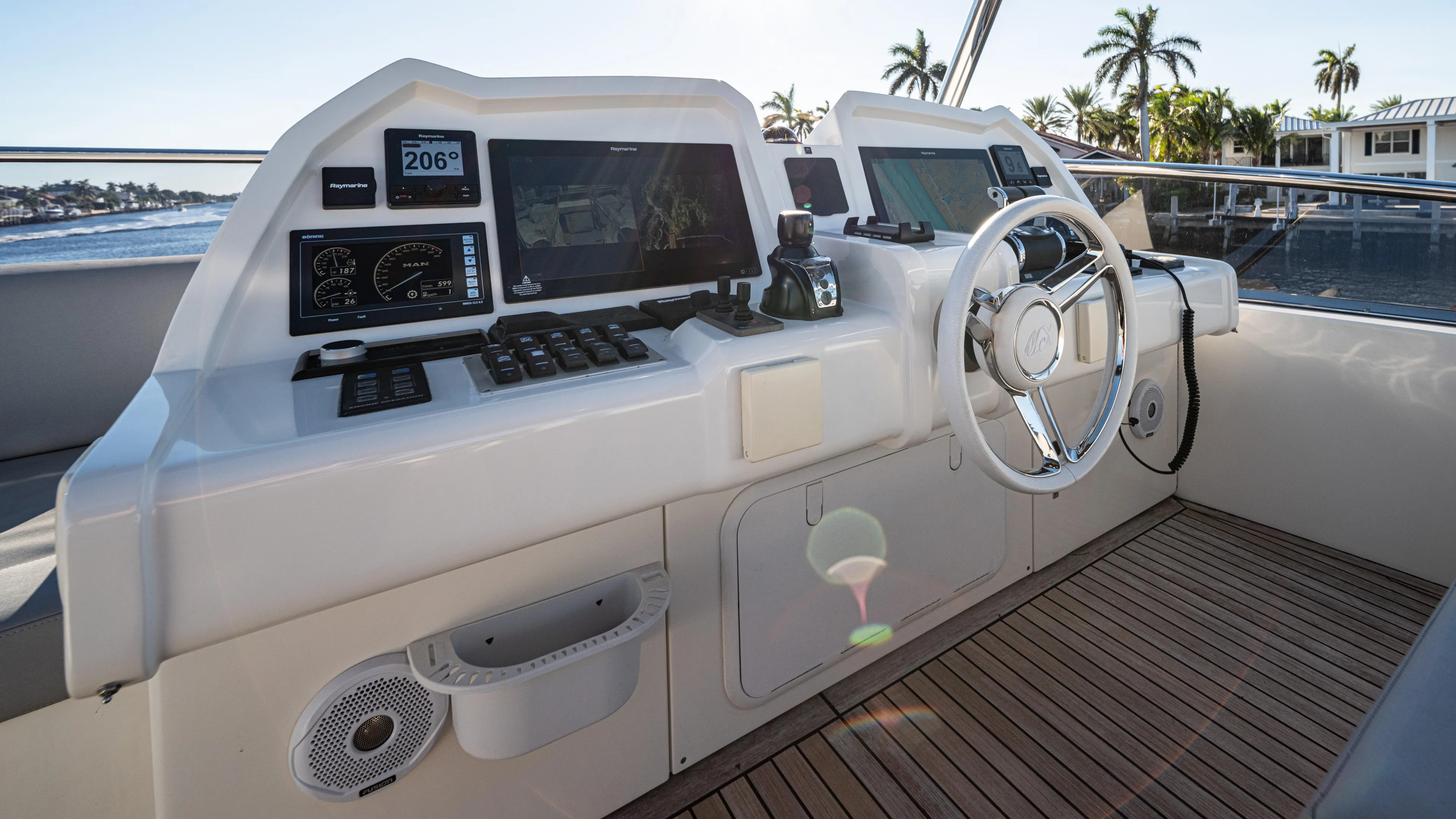 Classy Lady IV Yacht Photos Pics Helm of 2020 Monte Carlo Yachts MCY 66 with modern navigation equipment and steering wheel.