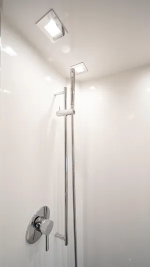 Classy Lady IV Yacht Photos Pics Shower area in 2020 Monte Carlo Yachts MCY 66, featuring sleek chrome fixtures.