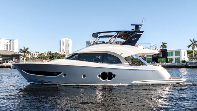 Classy Lady IV Yacht Photos Pics 2020 Monte Carlo Yachts MCY 66 luxury yacht on water, cityscape background.