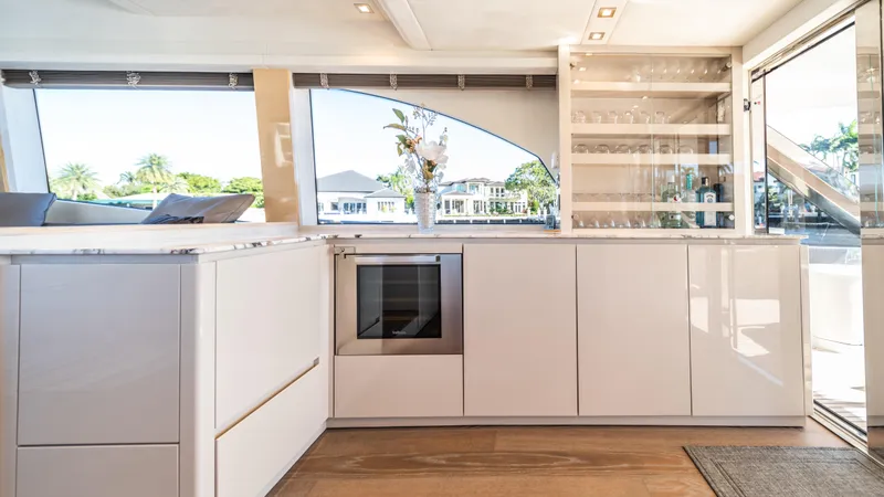 Classy Lady IV Yacht Photos Pics Luxurious interior of 2020 Monte Carlo Yachts MCY 66 with modern kitchen design.