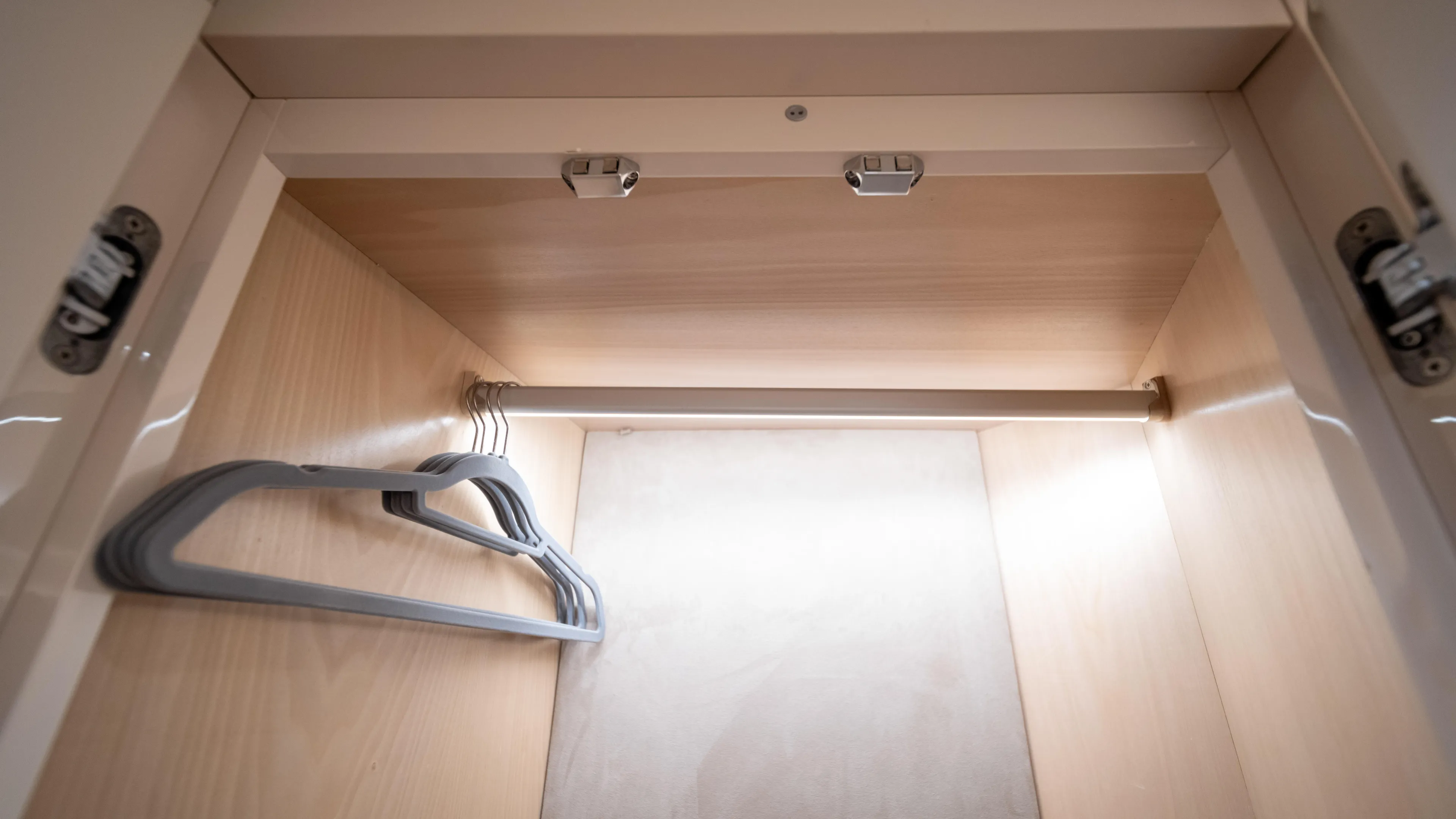 Classy Lady IV Yacht Photos Pics Empty wooden closet with hangers inside Monte Carlo Yachts MCY 66, 2020 model.