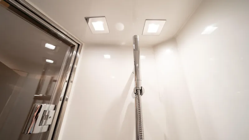 Classy Lady IV Yacht Photos Pics Shower area in 2020 Monte Carlo Yachts MCY 66, featuring modern fixtures and lighting.