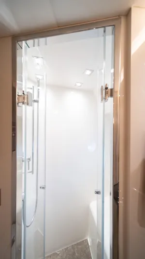 Classy Lady IV Yacht Photos Pics Shower area in 2020 Monte Carlo Yachts MCY 66, featuring sleek glass doors.