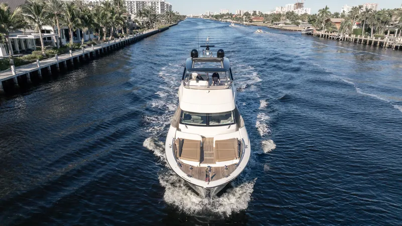 Classy Lady IV Yacht Photos Pics 2020 Monte Carlo Yachts MCY 66 cruising on a scenic waterway.