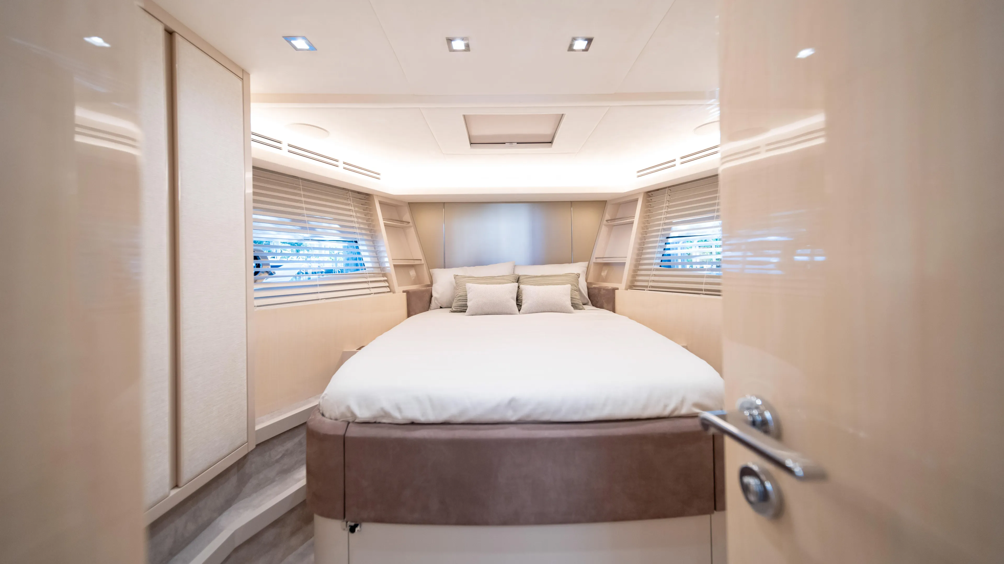 Classy Lady IV Yacht Photos Pics Luxurious bedroom interior of 2020 Monte Carlo Yachts MCY 66 with elegant design and soft lighting.
