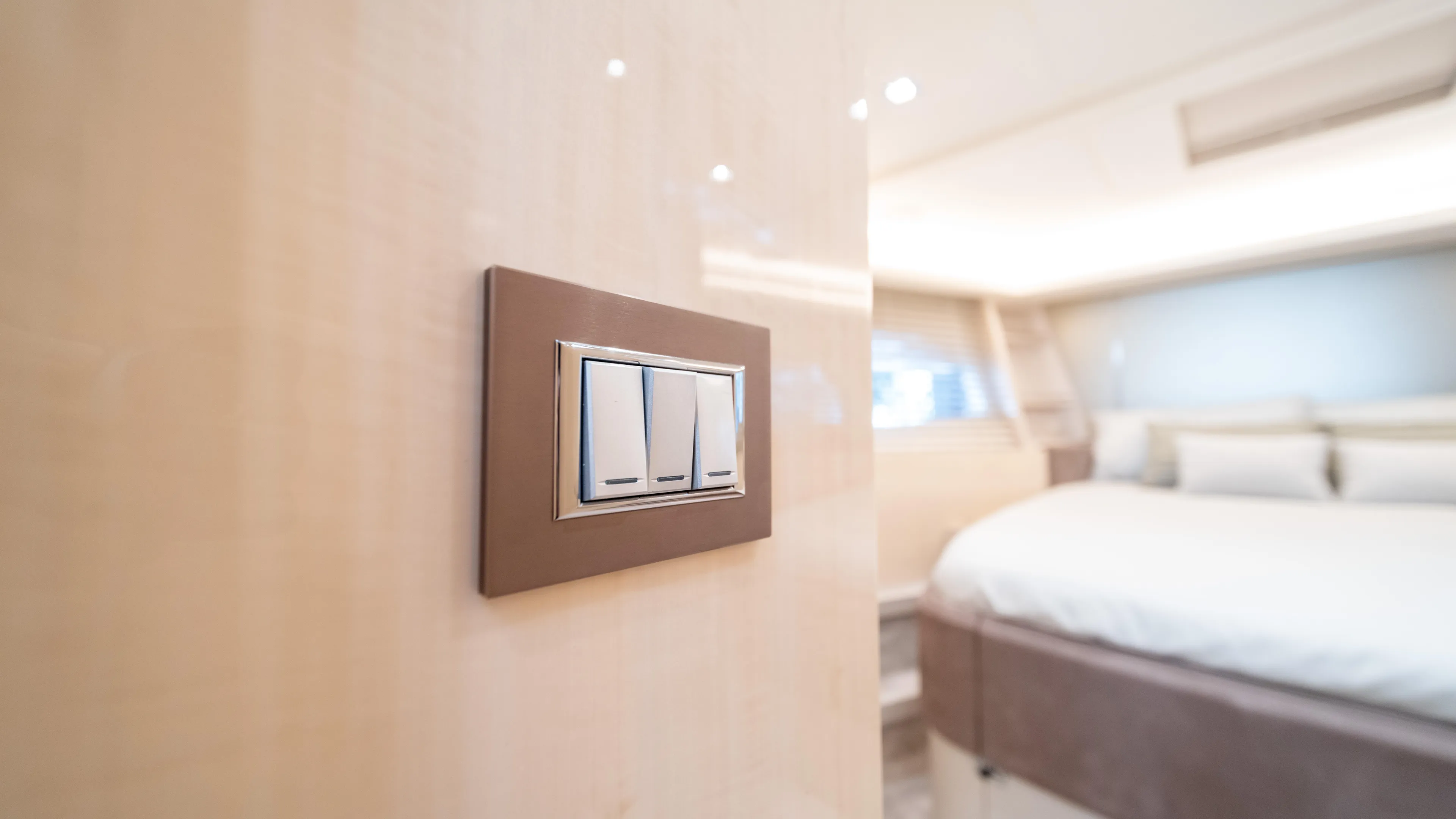 Classy Lady IV Yacht Photos Pics Luxurious bedroom interior of 2020 Monte Carlo Yachts MCY 66 with modern light switches.