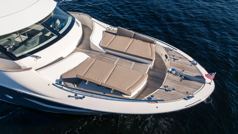 Classy Lady IV Yacht Photos Pics Luxury Monte Carlo Yachts MCY 66, 2020 model, with elegant deck seating on the water.