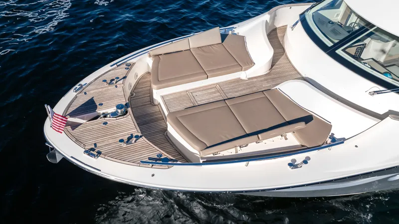 Classy Lady IV Yacht Photos Pics Luxurious 2020 Monte Carlo Yachts MCY 66 with spacious sunbathing deck on open water.