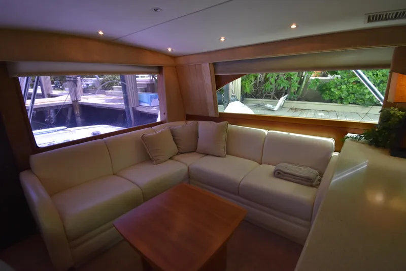  Yacht Photos Pics Interior of 2003 Ocean Yachts 48 Super Sport with white leather sofa and wooden table.