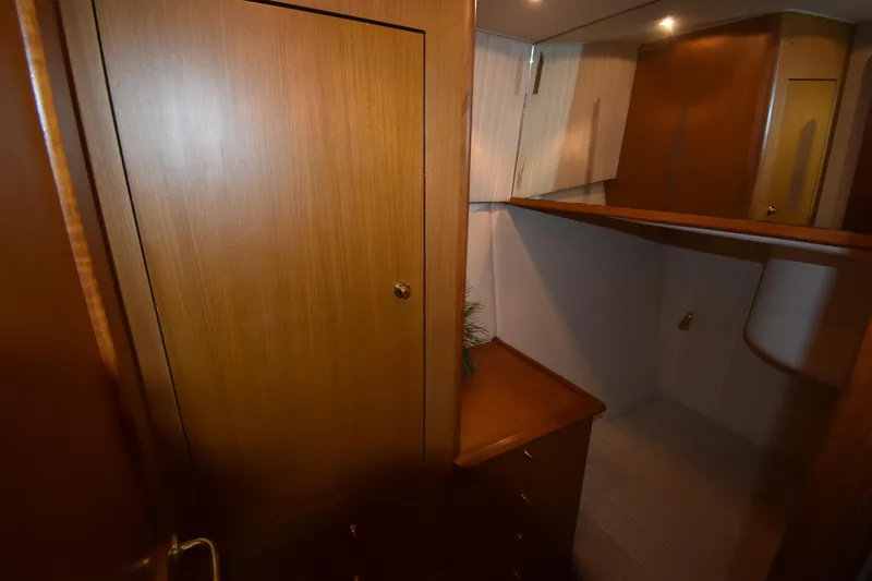  Yacht Photos Pics Interior cabin of 2003 Ocean Yachts 48 Super Sport with wooden cabinetry.