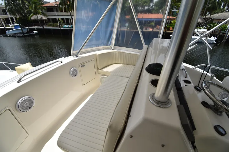  Yacht Photos Pics 2003 Ocean Yachts 48 Super Sport boat interior with cushioned seating and helm station.