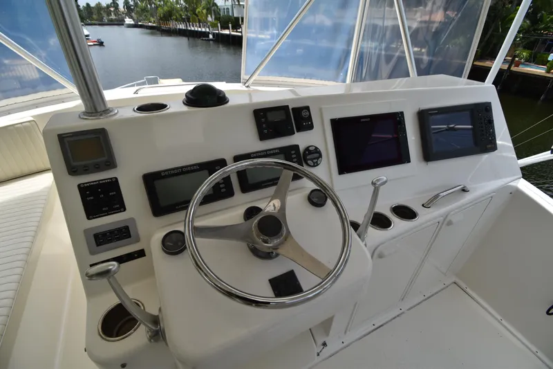  Yacht Photos Pics 2003 Ocean Yachts 48 Super Sport helm with navigation instruments and steering wheel.