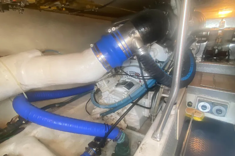  Yacht Photos Pics Engine room of a 2003 Ocean Yachts 48 Super Sport with blue hoses.