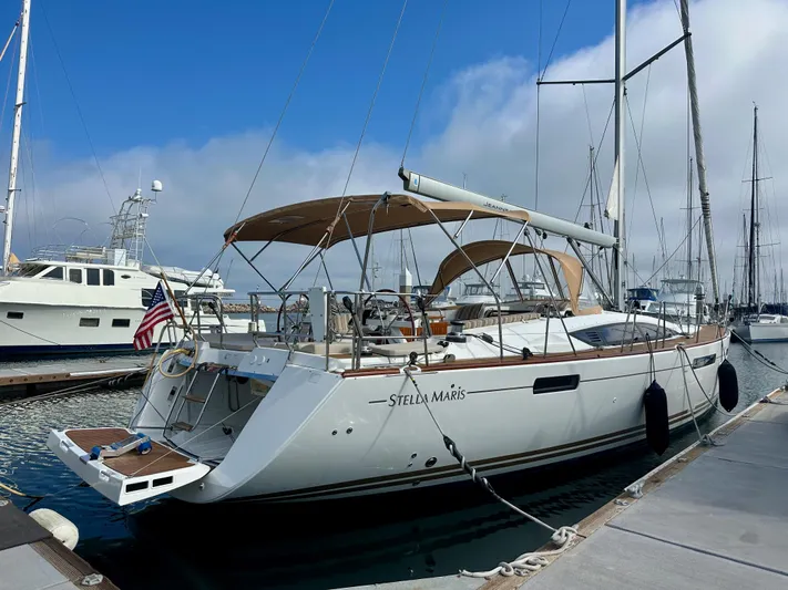 Stella Maris Yacht Photos Pics 2014 Jeanneau 57 yacht docked at marina, featuring sleek design and spacious deck.