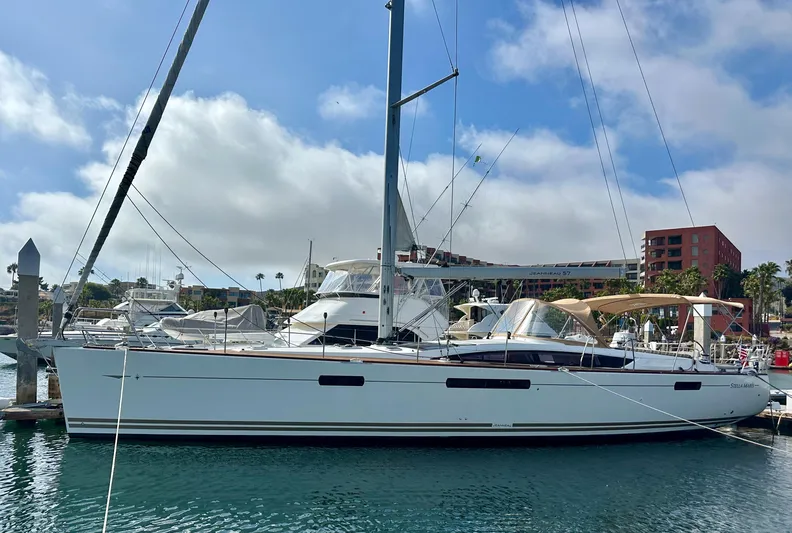 Stella Maris Yacht Photos Pics 2014 Jeanneau 57 yacht docked in a marina under a clear blue sky.