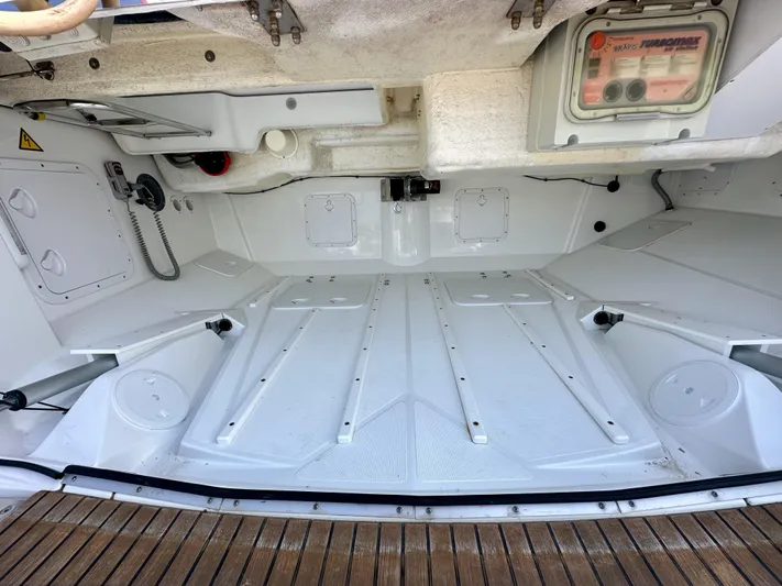Stella Maris Yacht Photos Pics Interior view of a 2014 Jeanneau 57 yacht, showcasing a clean, spacious storage compartment.