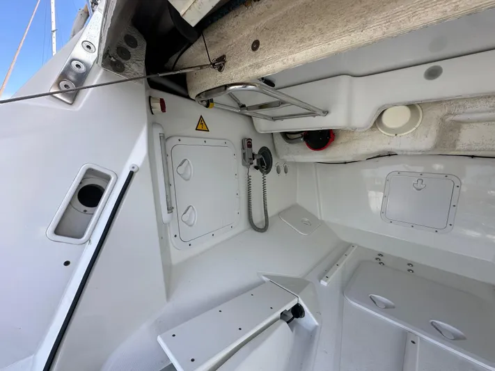 Stella Maris Yacht Photos Pics Interior view of a 2014 Jeanneau 57 sailboat, showcasing storage compartments and equipment.