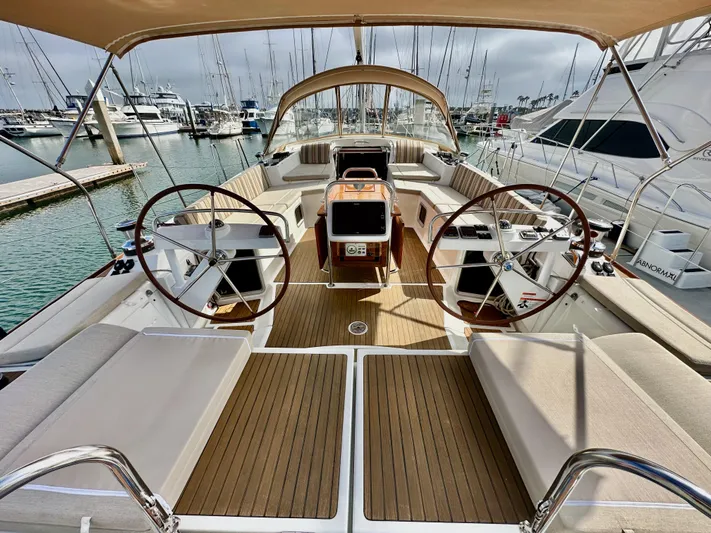 Stella Maris Yacht Photos Pics 2014 Jeanneau 57 yacht interior with dual steering wheels and spacious deck.