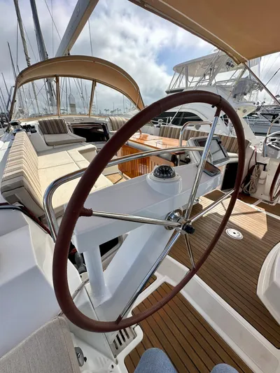 Stella Maris Yacht Photos Pics 2014 Jeanneau 57 yacht cockpit with steering wheel and seating area.