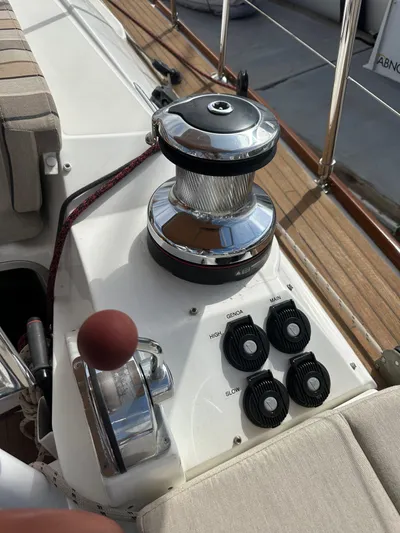 Stella Maris Yacht Photos Pics Jeanneau 57 sailboat deck controls and winch, 2014 model, featuring polished chrome and wood accents.