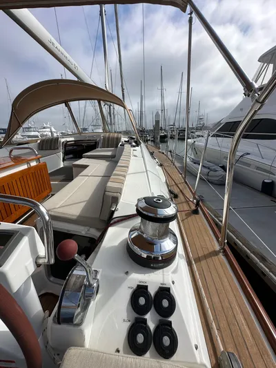 Stella Maris Yacht Photos Pics 2014 Jeanneau 57 yacht deck with seating and winch, docked at marina.