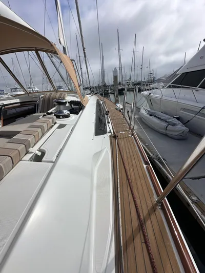 Stella Maris Yacht Photos Pics 2014 Jeanneau 57 yacht docked at marina, showcasing sleek deck design and luxurious seating.