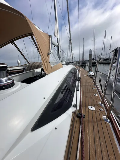 Stella Maris Yacht Photos Pics 2014 Jeanneau 57 yacht with teak deck, docked in marina.