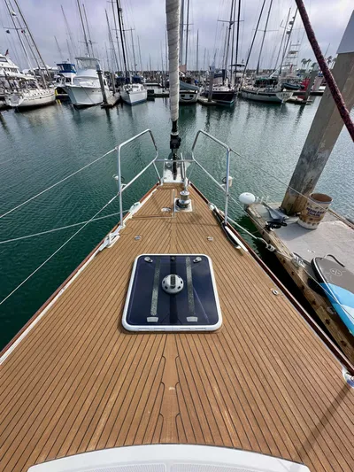 Stella Maris Yacht Photos Pics 2014 Jeanneau 57 yacht docked in marina, showcasing teak deck and sleek design.