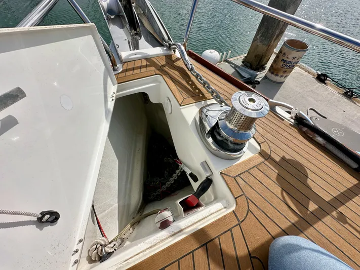 Stella Maris Yacht Photos Pics Anchor locker and winch on 2014 Jeanneau 57 yacht deck.