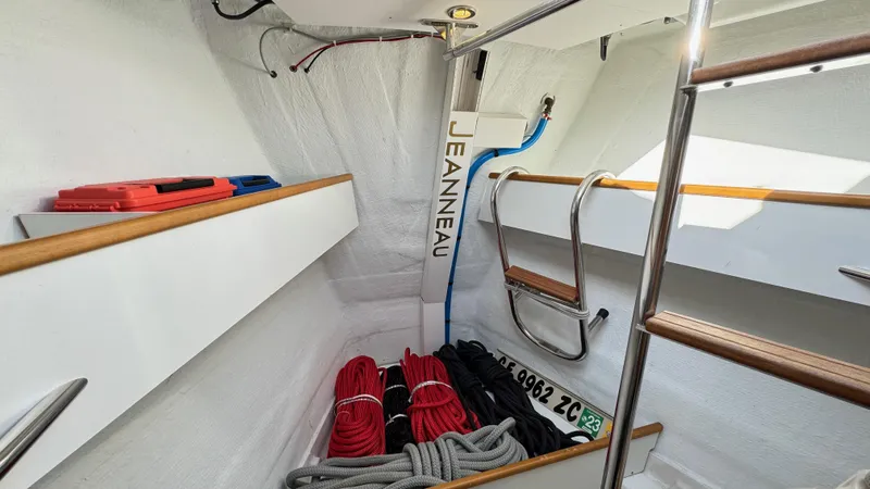 Stella Maris Yacht Photos Pics Interior of 2014 Jeanneau 57 sailboat with ropes and storage compartments.