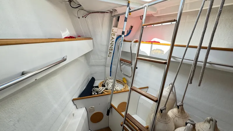 Stella Maris Yacht Photos Pics Interior of 2014 Jeanneau 57 sailboat with storage and ladder.