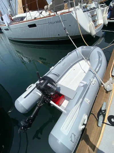 Stella Maris Yacht Photos Pics Inflatable boat with motor docked beside 2014 Jeanneau 57 yacht.