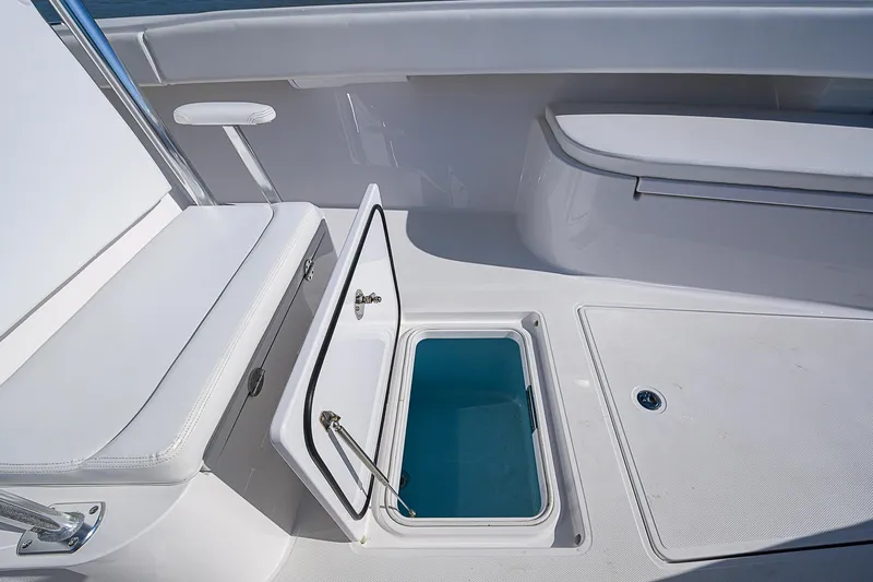 Grand Slam Yacht Photos Pics 2017 Bahama 41 boat interior with open storage compartment and seating area.