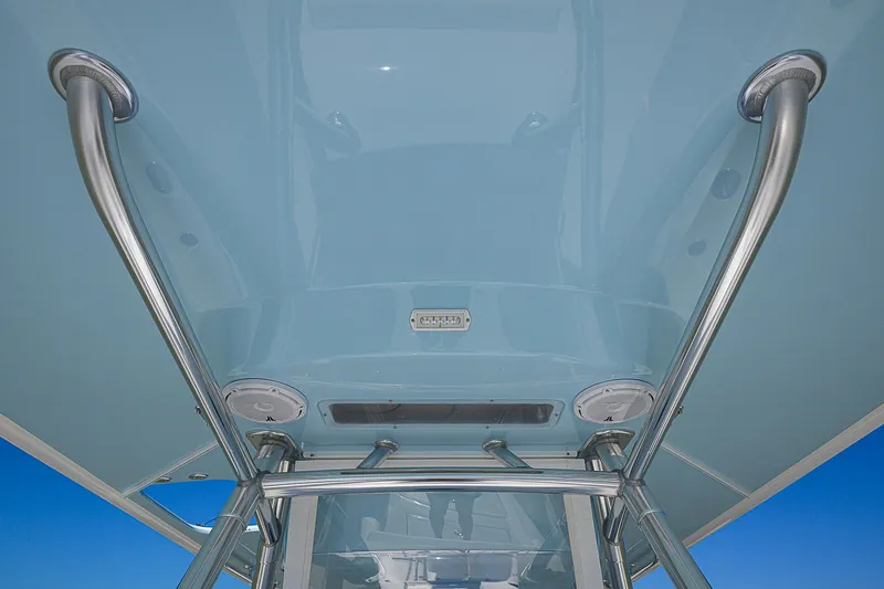 Grand Slam Yacht Photos Pics Bahama 41 boat, 2017 model, featuring sleek metal framework and blue canopy.