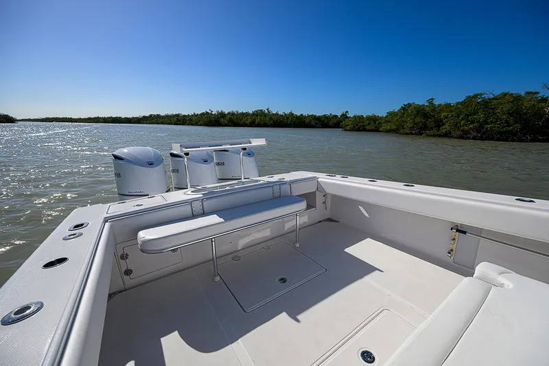 Grand Slam Yacht Photos Pics 2017 Bahama 41 boat on calm waters, featuring spacious deck and seating.