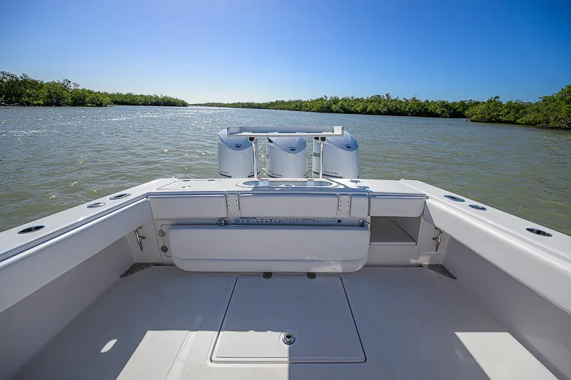 Grand Slam Yacht Photos Pics 2017 Bahama 41 boat on calm water, featuring spacious deck and clear blue sky.
