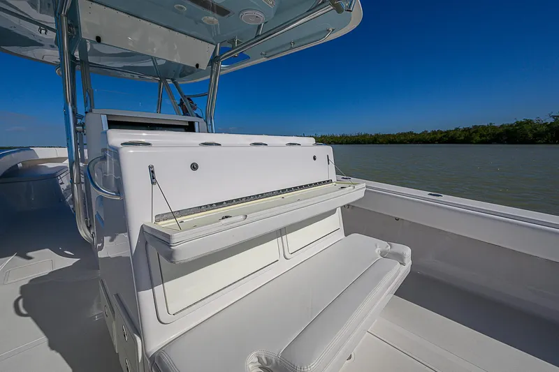 Grand Slam Yacht Photos Pics 2017 Bahama 41 boat interior with seating, under clear blue sky, near water and greenery.