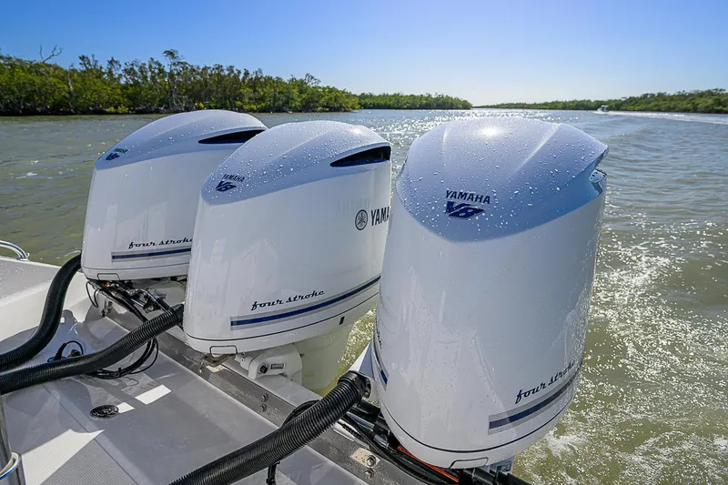 Grand Slam Yacht Photos Pics Triple Yamaha outboard engines on a 2017 Bahama 41 boat cruising in sunny waters.