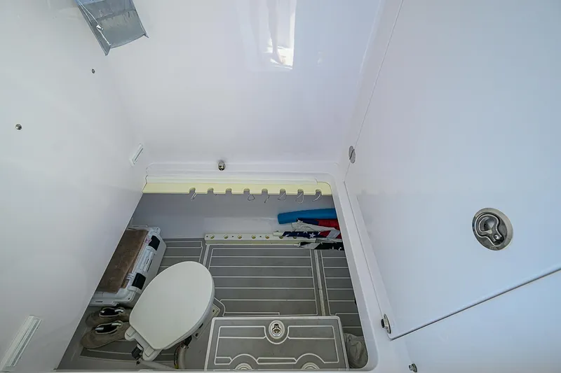 Grand Slam Yacht Photos Pics Interior of 2017 Bahama 41 boat bathroom with toilet and storage space.