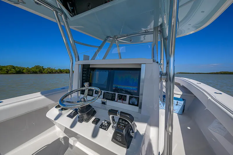 Grand Slam Yacht Photos Pics 2017 Bahama 41 boat helm with advanced navigation system on calm waters.