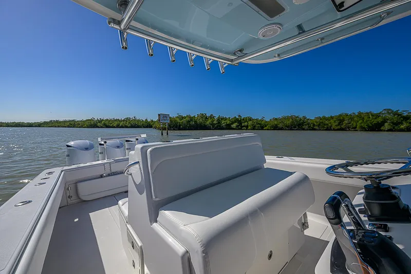 Grand Slam Yacht Photos Pics 2017 Bahama 41 boat on calm water, featuring sleek seating and clear blue skies.