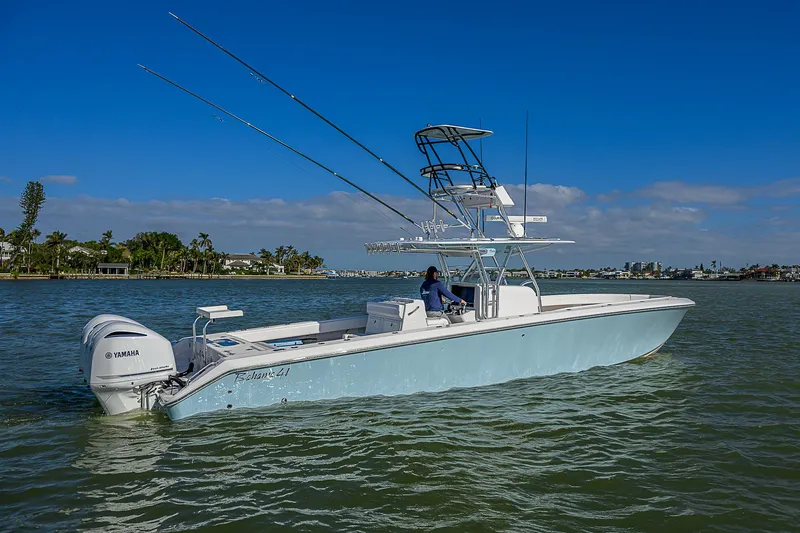 Grand Slam Yacht Photos Pics 2017 Bahama 41 boat on calm water with clear blue sky.