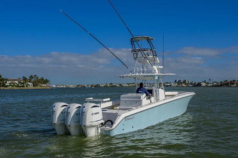 Grand Slam Yacht Photos Pics 2017 Bahama 41 boat with triple Yamaha engines cruising on a sunny day.
