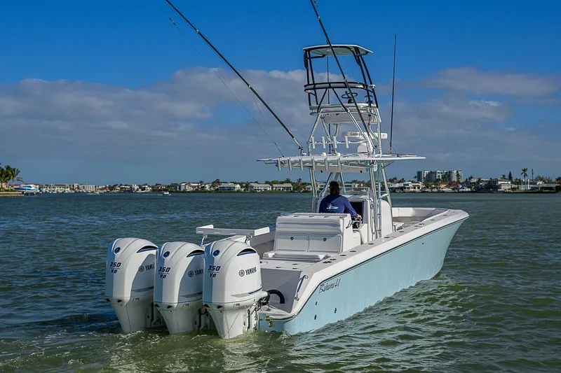 Grand Slam Yacht Photos Pics 2017 Bahama 41 boat with triple outboard engines cruising on a sunny day.