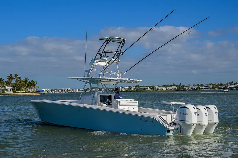 Grand Slam Yacht Photos Pics 2017 Bahama 41 boat with triple Yamaha engines cruising on a sunny day.