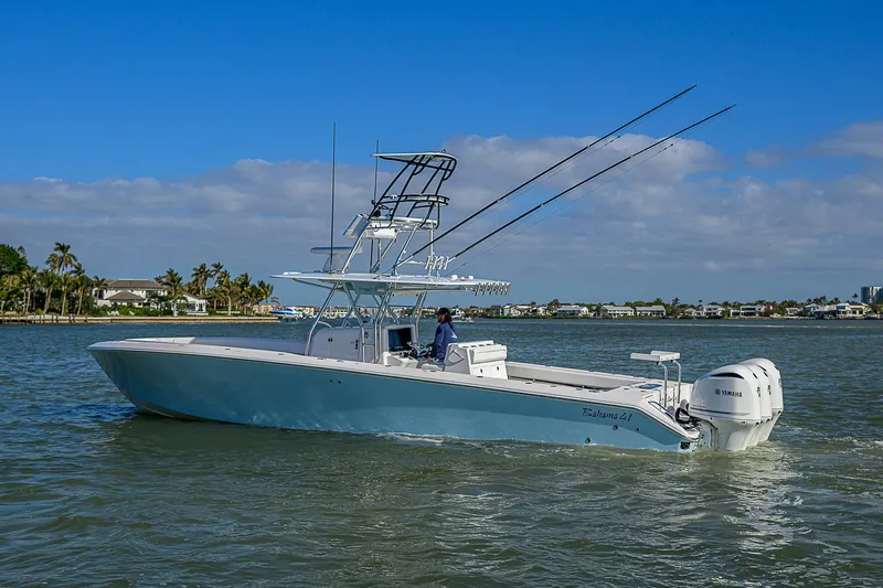 Grand Slam Yacht Photos Pics 2017 Bahama 41 boat cruising on a sunny day with clear blue skies.