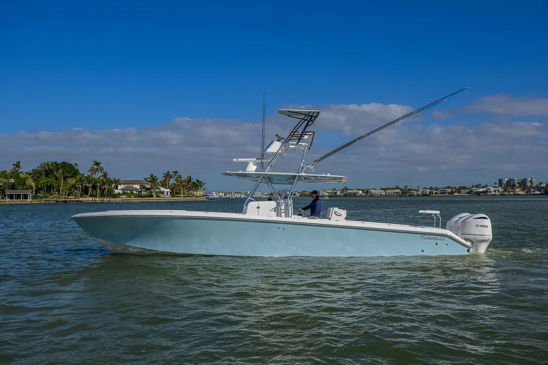 Grand Slam Yacht Photos Pics 2017 Bahama 41 boat on calm water under a clear blue sky.