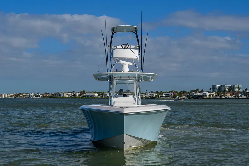 Grand Slam Yacht Photos Pics 2017 Bahama 41 boat on water, clear sky, coastal background.
