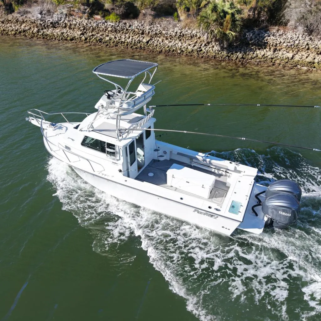 2023 Parker 2820 XLD Sport Cabin boat cruising on water.
